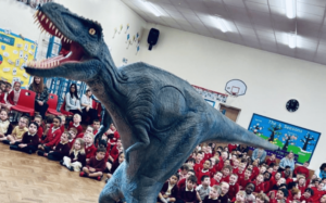 huge dinosaur in school assembly