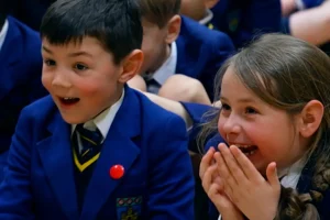 Children excited in a school hall School Children having fun