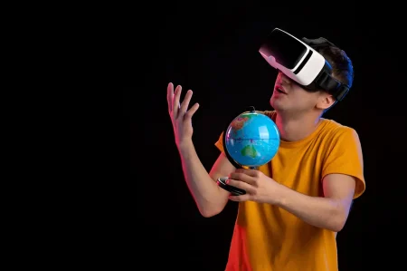 a teen holding a globe with VR