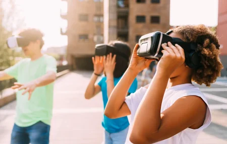 group of kids outside trying VR
