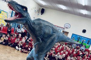 winner pic huge dinosaur in school assembly